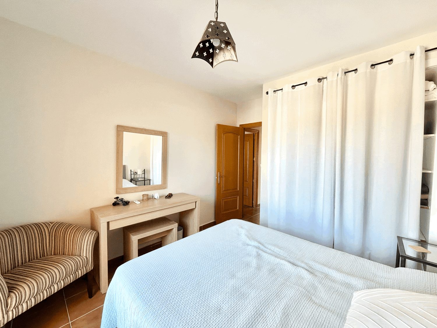 Charming four-bedroom townhouse in a gated community with a swimming pool